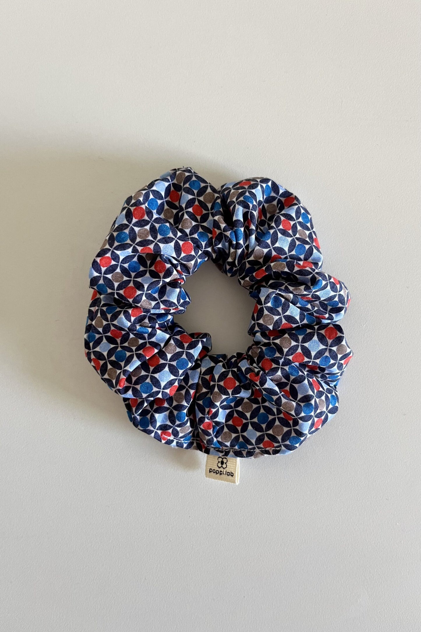 Scrunchie fantasia geometrica rosso/blu/azzurro